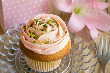 Pink cup cake with gift box and pink lily flower for birthday celebration background