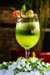 Cocktail of cucumbers and greens in a glass.