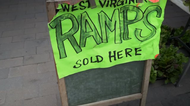 Sign advertising West Virginia Ramps at local farmer’s market. Shot with steadicam pushing into sign.