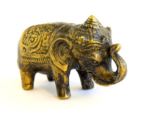 Obraz premium The sculpture of an elephant is made of old bronze. The sculpture is located on a white background