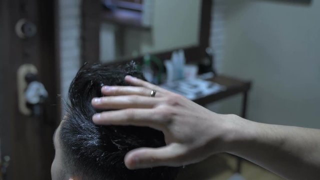 barber does the styling to a man4