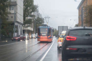 Obraz premium Tram in Moscow, Russia. Heavy traffic on the road
