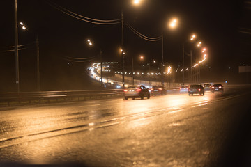 road at night with car light trail