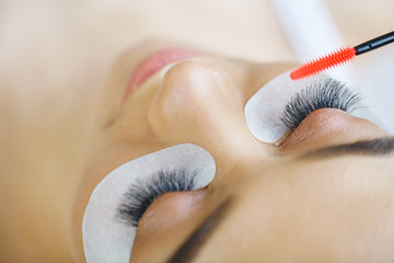 Woman eye with long eyelashes. Mascara Brush. High quality image