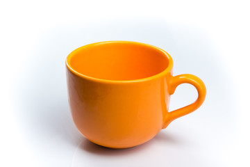 Orange cup of coffee on a White background. bowl