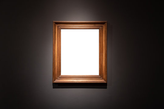 Blank hanging individual frame in an art gallery black background