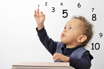 child learning numbers stock photo