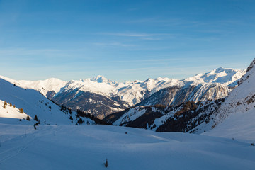 Alps winter landscape of slopes, off piste skiing, snowboarding in French resort of Courchevel, Les Trois Vallees , on a sunny day. France 2018.
