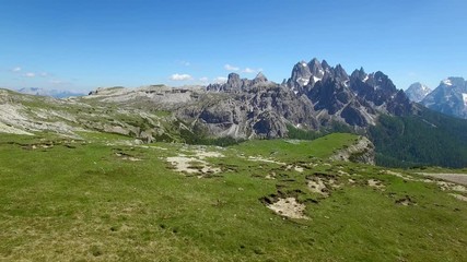 AERIAL VIEW: flight over National Park Tre Cime Di Lavaredo. Italian Dolomite