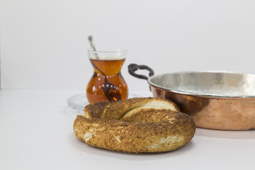 Simit (Turkish bagel) isolated on white background . Tea concept with bagel .