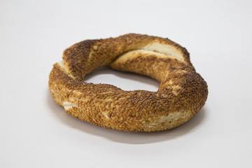 Simit (Turkish bagel) isolated on white background . Tea concept with bagel .