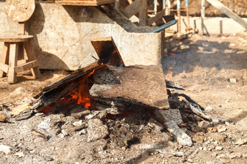 Flame of fire from firewood and building wooden boards