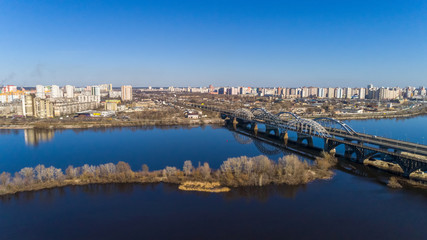 Fototapeta na wymiar Aerial view of the Kiev city, Ukraine. Dnieper river with bridges. Darnitskiy bridge
