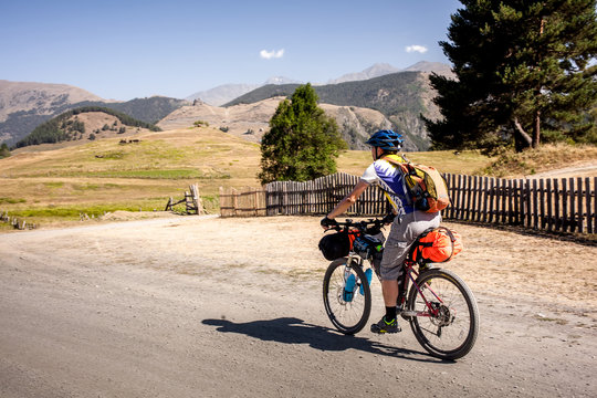 Mountain biker is travelling in the highlands of Tusheti region, Georgia