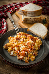 Scrambled eggs with sausage.