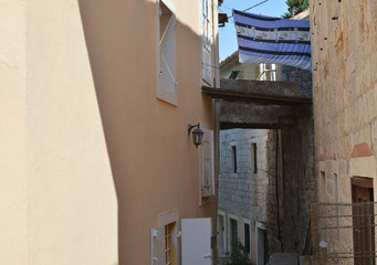 Small lane of a coastal village with houses one across another
