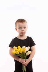 Young boy holding tulips isolated on white