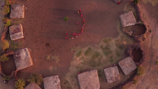 Aerial of a Maasai village with people