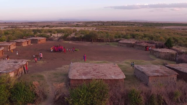Aerial of a Maasai settlement with people