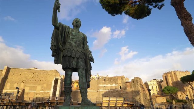 Statue of emperor Julius Caesar along Via dei Fori Imperiali at the Roman Forum in Rome, Italy