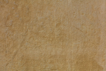 Weathered yellow painted wall background