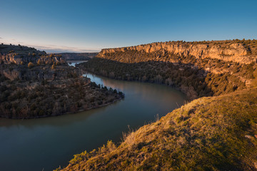 Hoces del Duraton canyon during golden hour in Segovia, Spain.