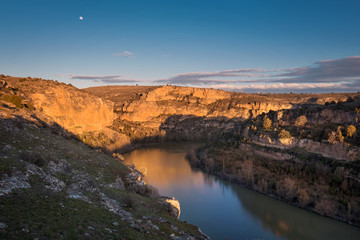 Hoces del Duraton canyon natural park during golden hour in Segovia, Spain.