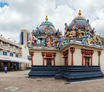 Panoramic view of the Sri Mariamman Hindu Temple in Chinatown, Singapore. Fragment of facade with painted figures of Hindu gods and deities.