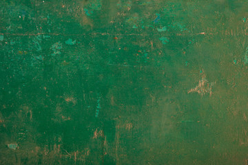 Weathered green painted wall background partly faded