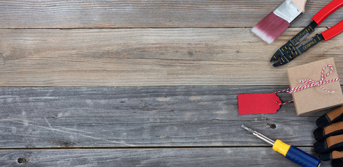 Fathers day gift box and tools on rustic wooden plank background - Powered by Adobe