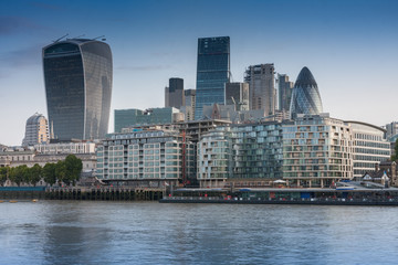 Naklejka premium Thames embankment and london skyscrapers in City of London in the sunrise time.