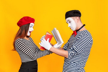 Handsome couple reading book together