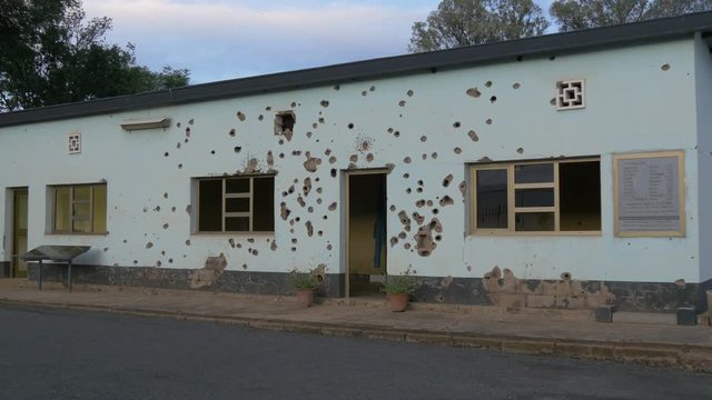 Bullet ridden wall at Kigali Camp