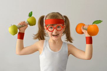 Kid, child, lifts weights from apples oranges.