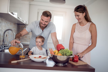 Family preparing meal with son