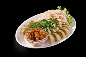 Spicy pickled cucumbers, tomatoes and cabbage with carrots