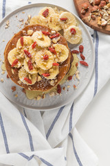 Pancakes with banana, walnuts, goji and honey