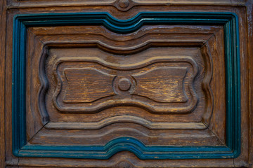 Beautiful, colorful piece of turquois, blue, brown hand, old, antique, made,  mexican, wooden door in Valle de Bravo / Mexico, background