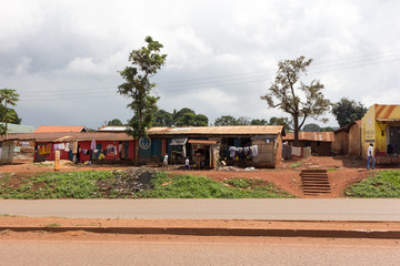 Fototapeta na wymiar Jinja, Uganda. 21 May 2017. Bungalow houses along a road in the town of Jinja.