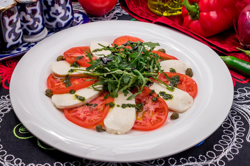 Caprese salad with mozzarella and tomato