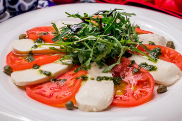 Caprese salad with mozzarella and tomato