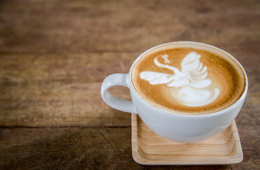 latte art coffe on table