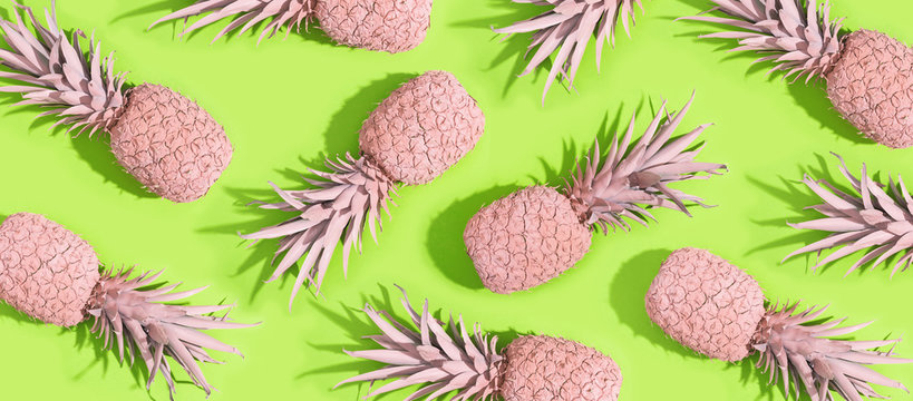 Painted pineapples on a vivid green background