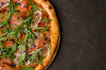 Pizza with Parma ham and arugula