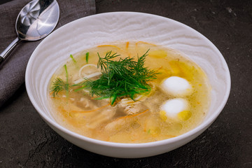 Chicken soup bouillon in a plate