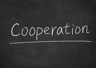 Obraz premium cooperation concept word on a blackboard background