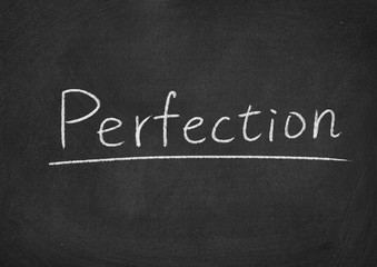 perfection concept word on a blackboard background