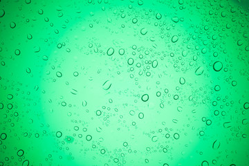 Rain droplets on green glass background, Water drops on glass.