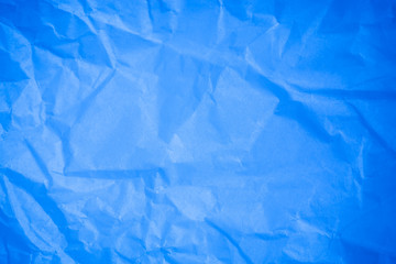Crumpled blue paper background.