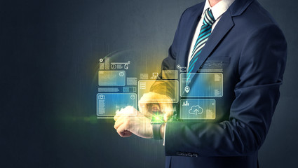 Businessman wearing smartwatch with data symbols and concept. 